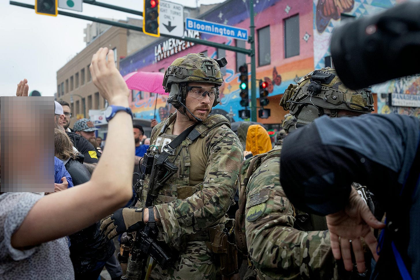 Community members confront law enforcement outside Las Cuatro Milpas restaurant, Minneapolis, June 3, 2025 (Elizabeth Flores/The Minnesota Star Tribune)