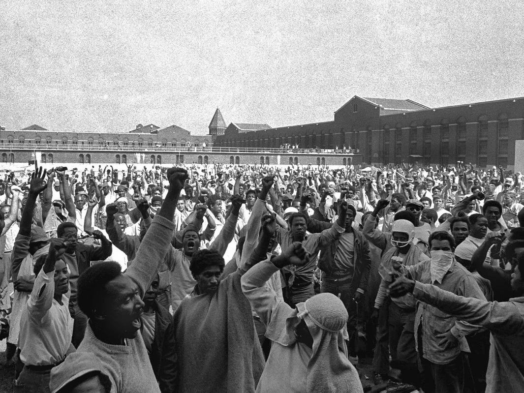 Prisoners raise fists during the Attica uprising, September 10, 1971. Photo: AP